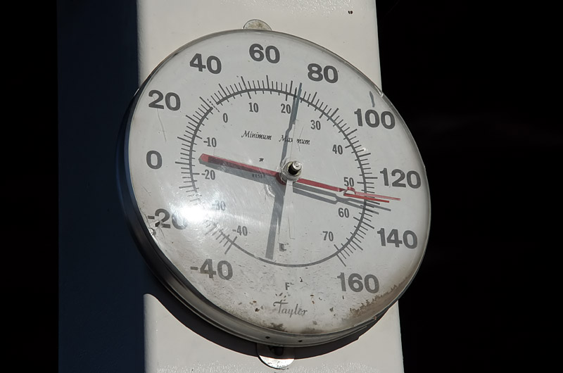 Thermometer reading 130 degrees in the desert