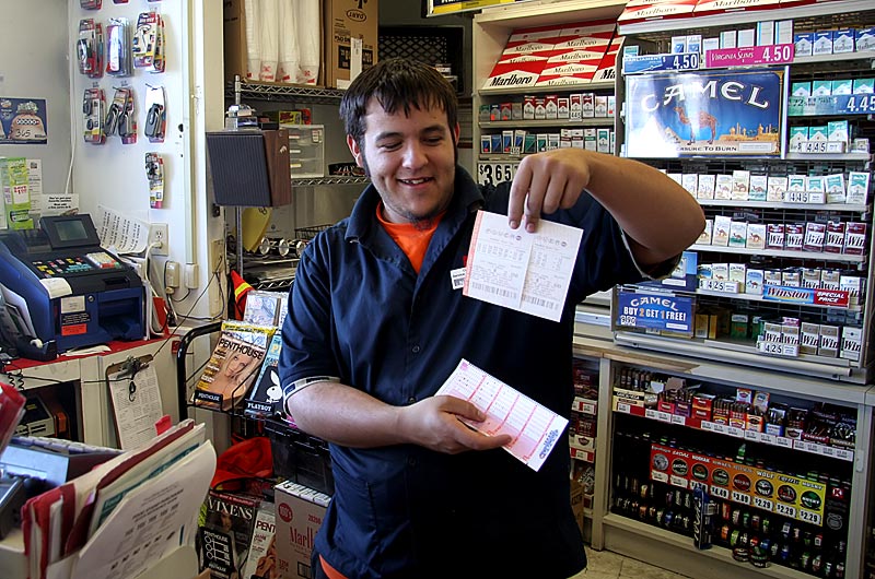 Tonights winning Powerball numbers are in this guys hands as we buy the lucky ticket at a local Circle K convenience store in Phoenix, Arizona