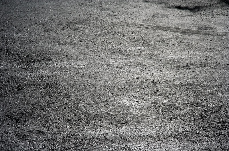 Scorching black asphalt burning under the desert sun in Phoenix, Arizona