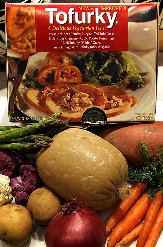 A Tofurky and vegetables ready to be put in the oven