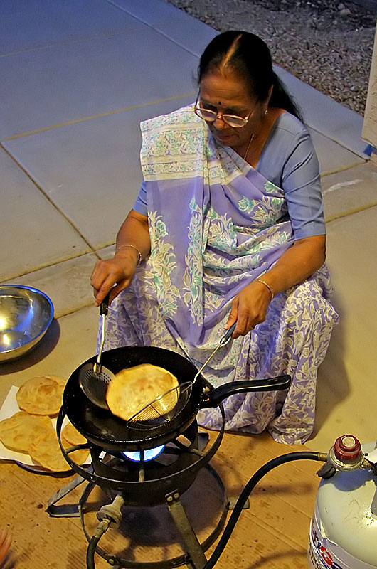 Mandakini (Sonal's mom) making bhatura (fried bread) for dinner 