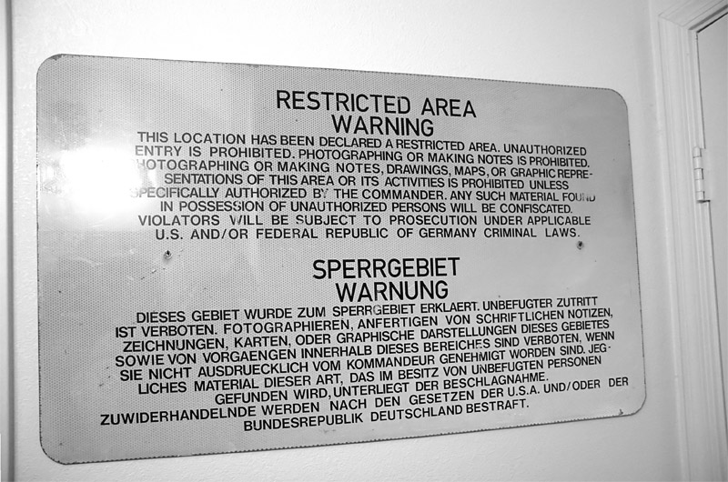 A "Restricted Area Warning" sign from a United States military installation in Frankfurt, Germany