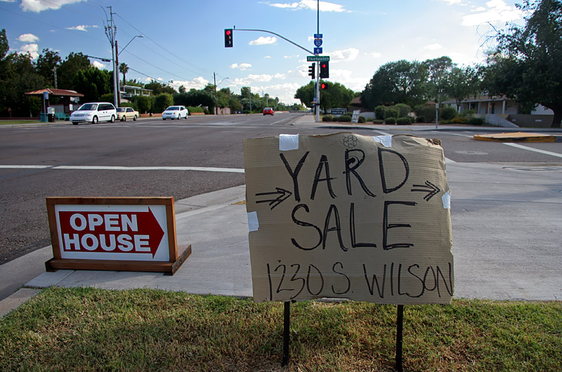 Homemade sign at intersection announcing a "Yard Sale"