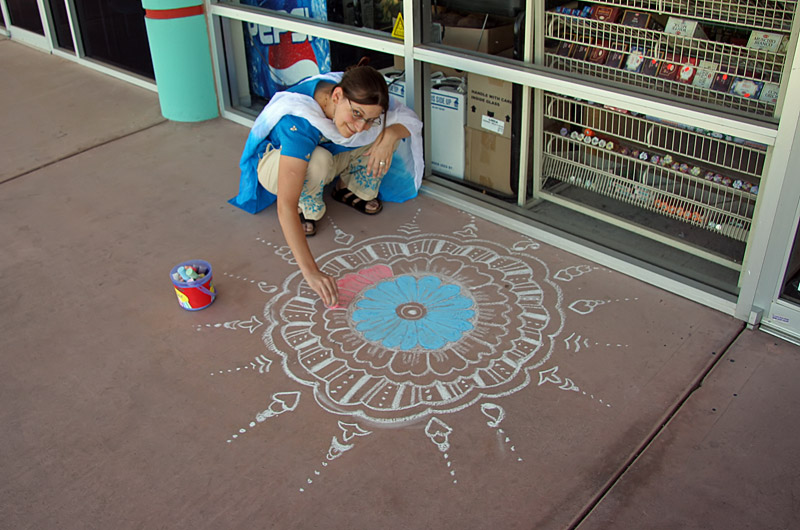 Caroline Wise helping draw a Rangoli for Diwali in Phoenix,Arizona