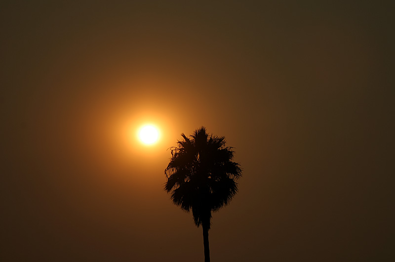 Smoke from a local wildfire turns the sky reddish brown over Santa Barbara, California