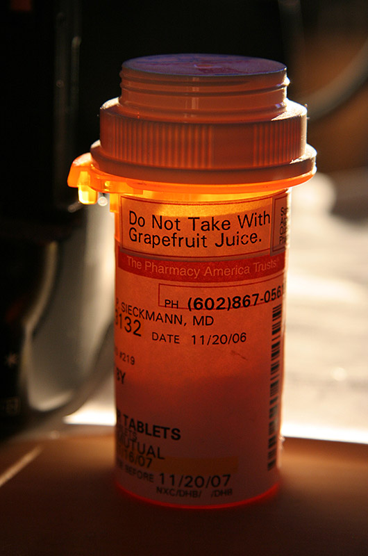 A prescription bottle in the afternoon sun