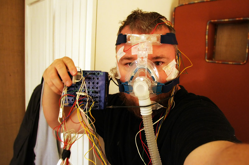 John Wise waking up from sleep study utilizing a cpap device