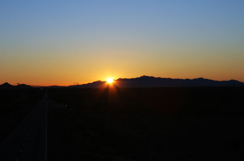 Sunrise looking back towards Phoenix from 339th Avenue in Tonopah, Arizona