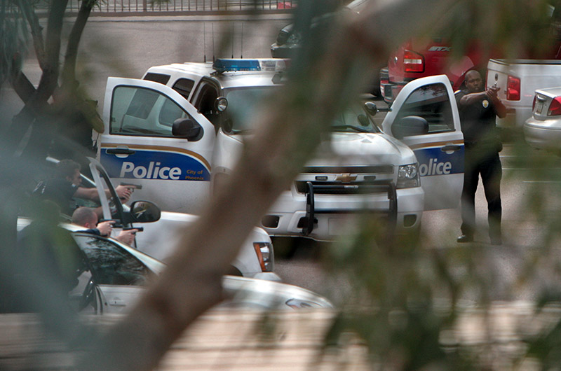 Phoenix Police arresting a suspect with guns drawn