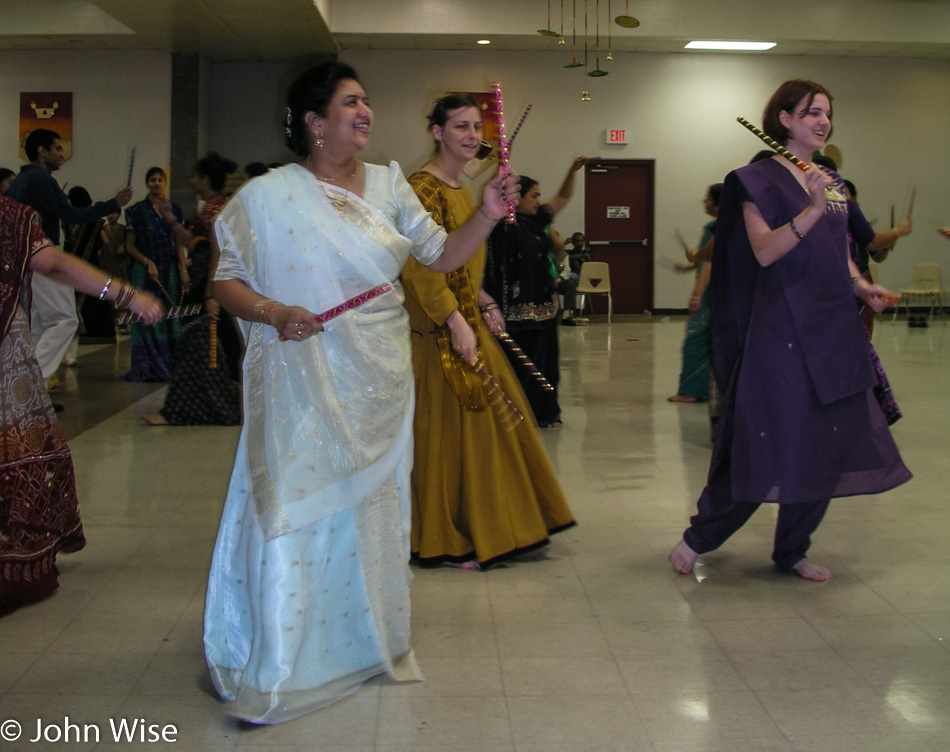 My daughter Jessica Wise, Sonal Patel, and Caroline Wise dancing with Dandiya at a Garba held for a friend getting married here in Phoenix, Arizona