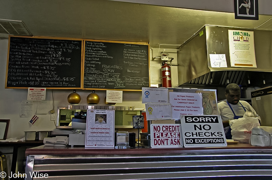 Stacy behind the counter at Stacy's soul food restaurant in Phoenix, Arizona