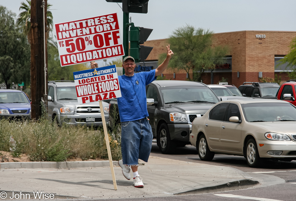 Man as dancing street advertisement in Phoenix, Arizona