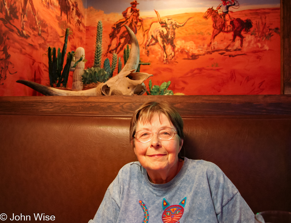 My mother-in-law Jutta sitting in the rustic old west atmosphere of Lone Star Steakhouse in Phoenix, Arizona