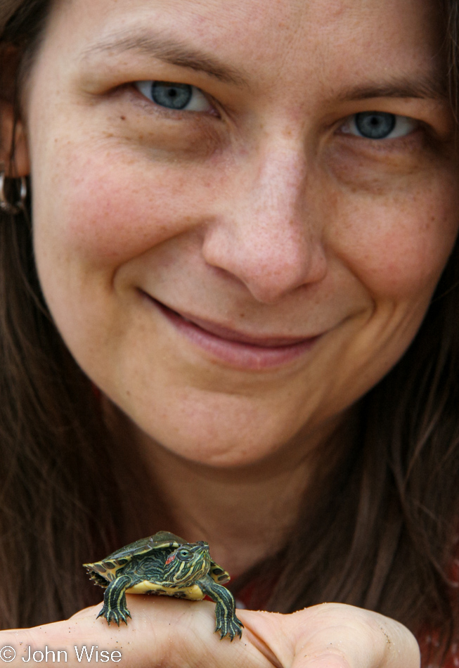 Caroline Wise with turtle at Huntington Beach, California