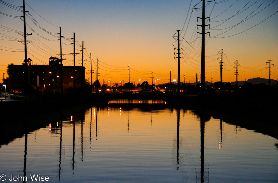 The Phoenix, Arizona water supply comes in on open canals such as this one seen at sunset