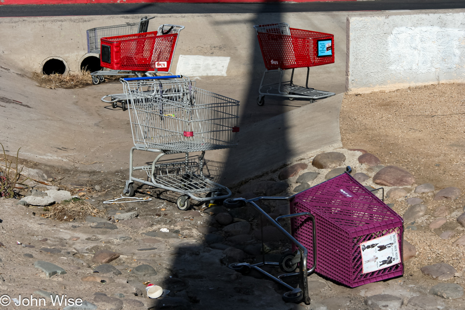 On a Phoenix, Arizona, corner where for some odd reason many a person has abandoned these shopping carts far from the stores they came from