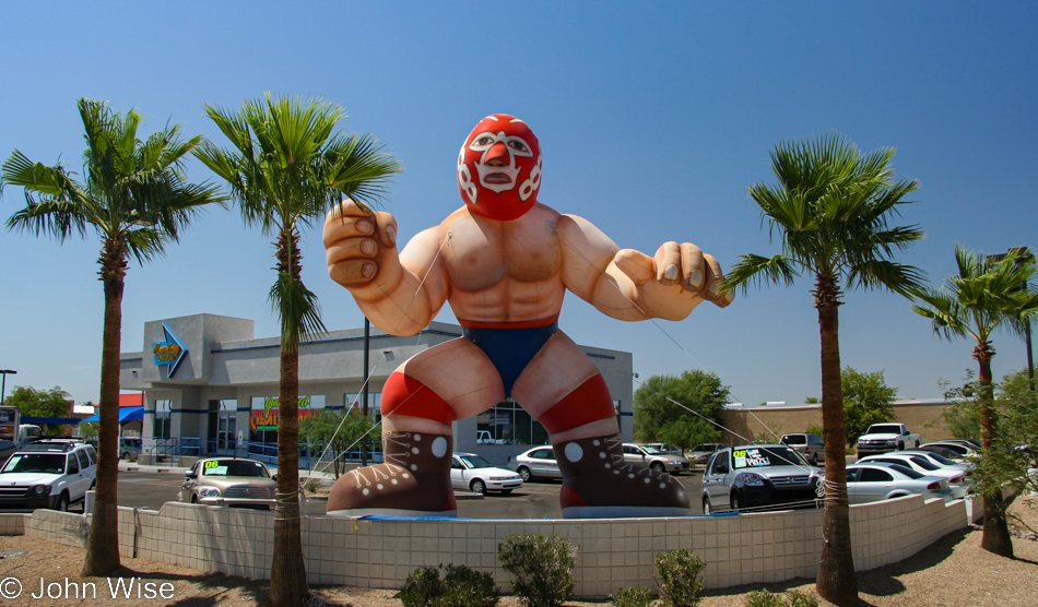 An inflatable Mexican Professional Wrestler, wrestling in Mexico is known as Lucha Libre, is on display at a local car dealer in Phoenix, Arizona