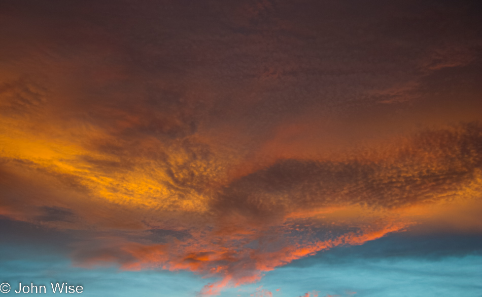 Impossibly colored late afternoon sky with clouds aglow