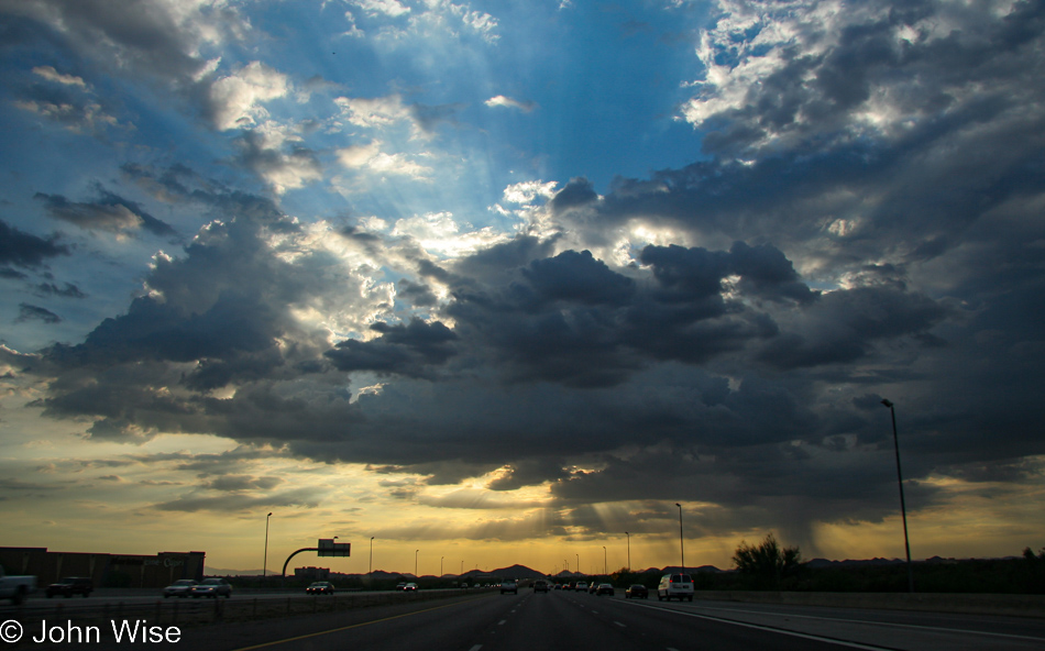 Sun rays stretching across the sky and pushing down to earth at sunset in Phoenix, Arizona