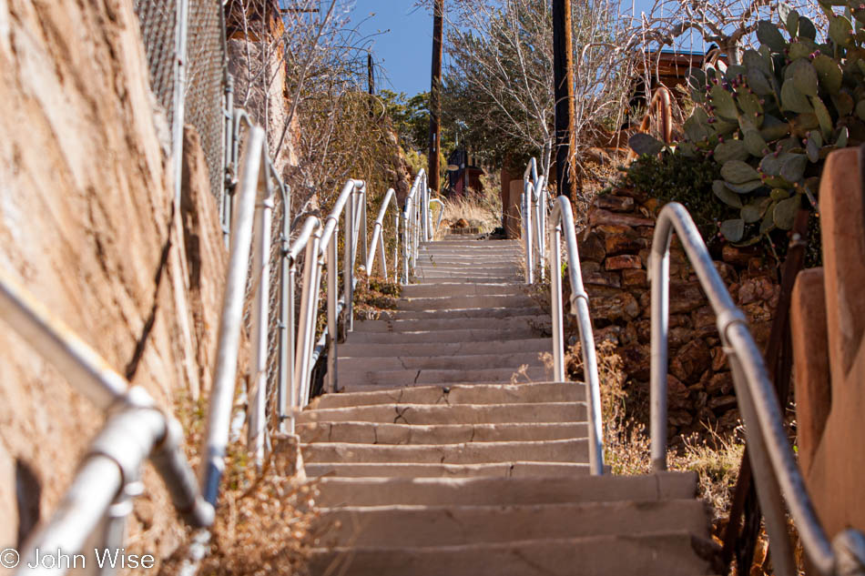 Uneven old stairs running between streets on the steep hillsides of the old mining town of Bisbee, Arizona