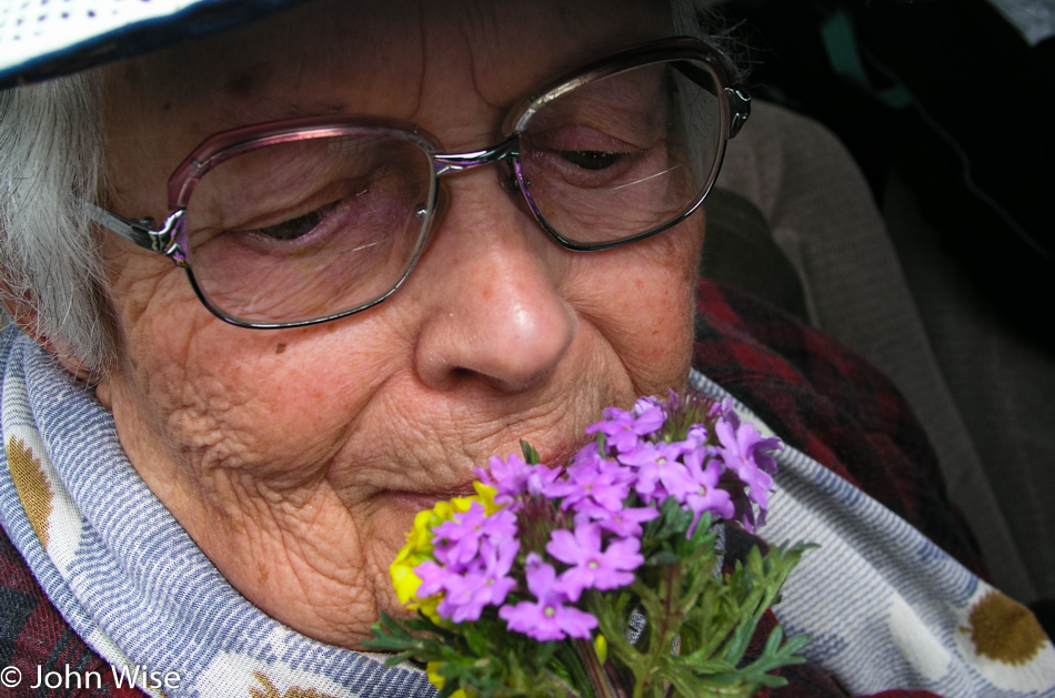 Eleanor Burke smelling the flowers in Texas