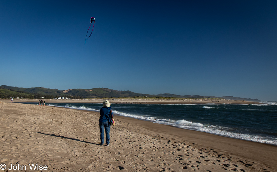 Caroline Wise flying her kite on Taft Beach in Lincoln City, Oregon