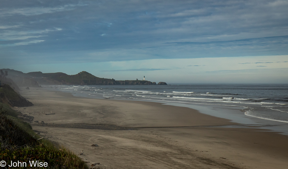 Yaquina Head Lighthouse seen from Moolack Beach overlook in Newport, Oregon