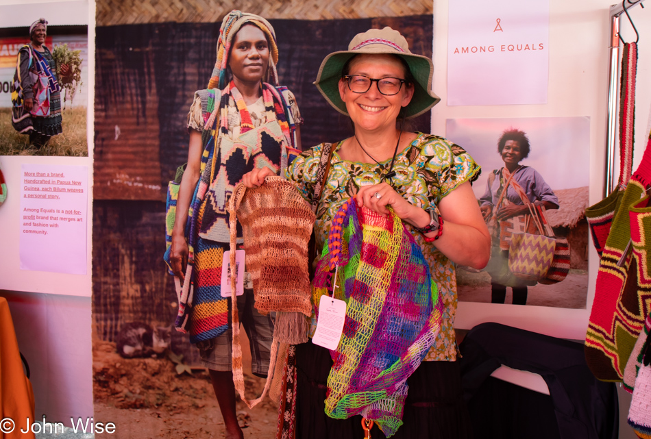 Caroline Wise visiting Papua New Guinea booth at the International Folk Art Market in Santa Fe, New Mexico