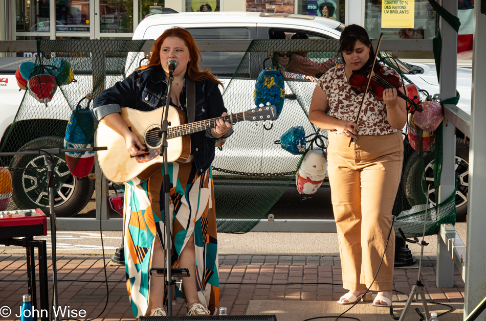 Two women performing publicly in Shediac, New Brunswick, Canada