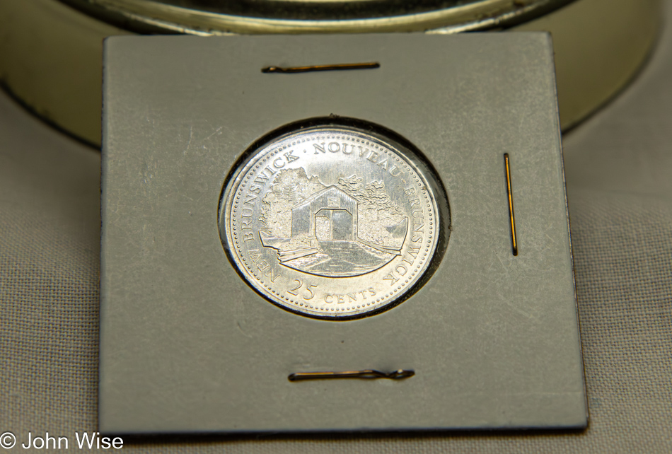 Canadian Twenty-Five cent piece featuring the Oldfields Covered Bridge in Mount Pisgah, New Brunswick, Canada